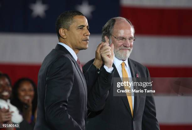 President Barack Obama and New Jersery Governor Jon Corzine look on at a campaign rally at Fairleigh Dickinson University's Hackensack campus October...