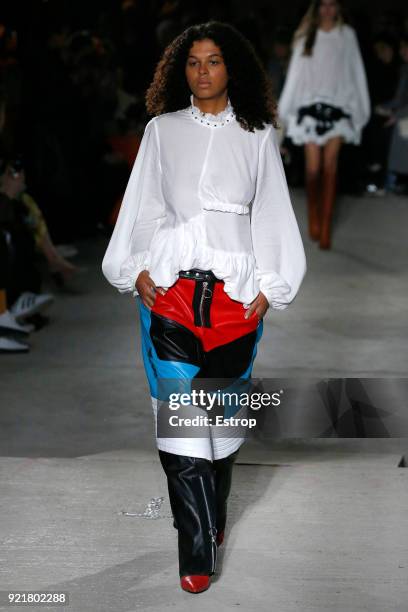 Model walks the runway at the Marques'Almeida show during London Fashion Week February 2018 on February 19, 2018 in London, England.