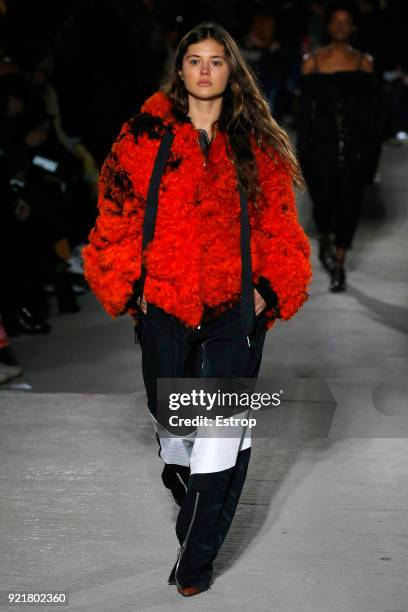 Model walks the runway at the Marques'Almeida show during London Fashion Week February 2018 on February 19, 2018 in London, England.