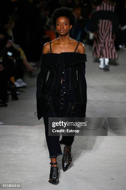 Model walks the runway at the Marques'Almeida show during London Fashion Week February 2018 on February 19, 2018 in London, England.