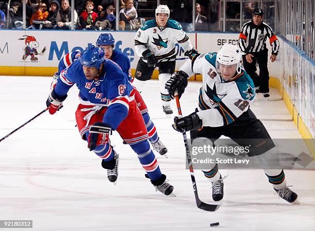 Patrick Marleau of the San Jose Sharks skates with the puck against the New York Rangers on October 19, 2009 at Madison Square Garden in New York...