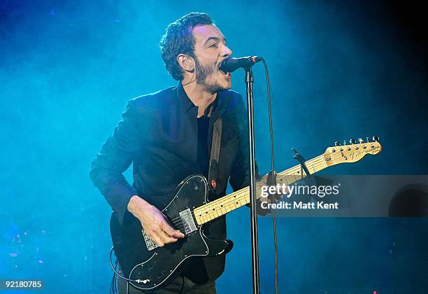 Tom Smith of Editors performs at Hammersmith Apollo, London on October 21, 2009 in London, England.