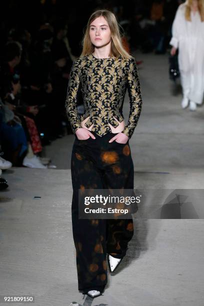 Model walks the runway at the Marques'Almeida show during London Fashion Week February 2018 on February 19, 2018 in London, England.