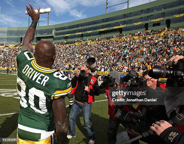 Donald Driver of the Green Bay Packers waves to the crowd following a win over the Detroit Lions at Lambeau Field on October 18, 2009 in Green Bay,...