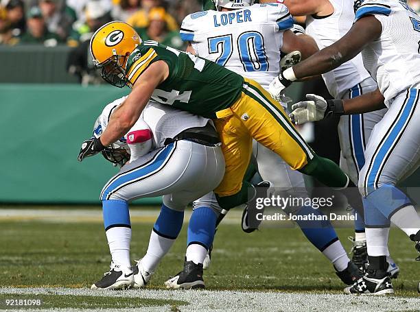 Aaron Kampman of the Green Bay Packers sacks Duante Culpepper of the Detroit Lions at Lambeau Field on October 18, 2009 in Green Bay, Wisconsin. The...