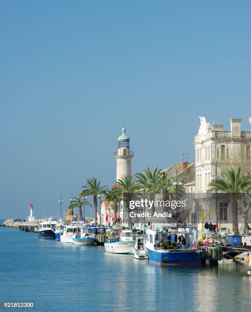 Le Grau-du-Roi : fishing boats alongside the quay 'quai General de Gaulle'. In the background, the Old Lighthouse registered as a National Historic...