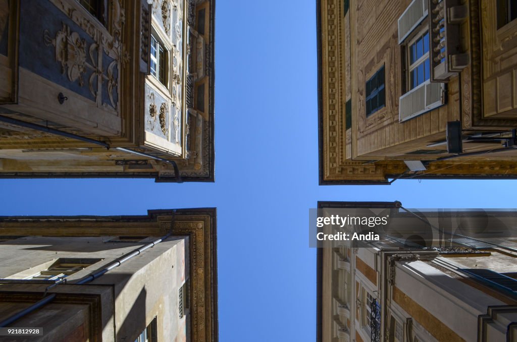 Low-angle shot of the inner yard of a palace along Via Garibaldi.