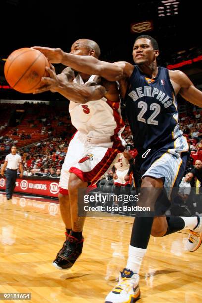 Quentin Richardson of the Miami Heat battles for a loose ball with Rudy Gay of the Memphis Grizzlies during a pre-season game on October 21, 2009 at...