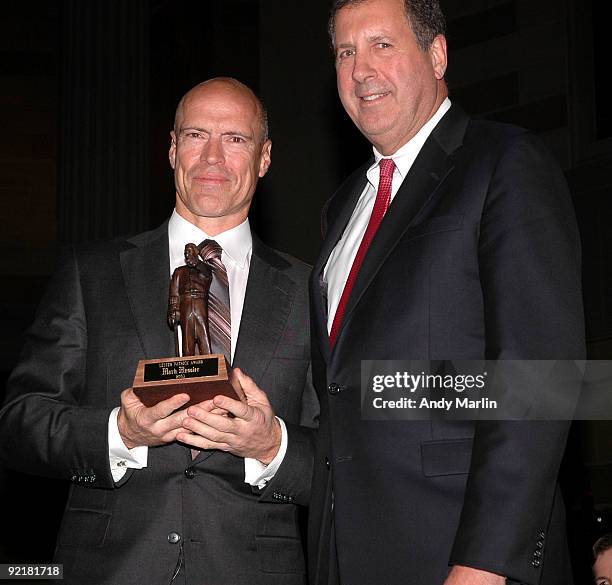 Hall of Fame member Mark Messier accepts the 2009 Lester Patrick Trophy from Owner and President of the Washington Capitals Dick Patrick during the...