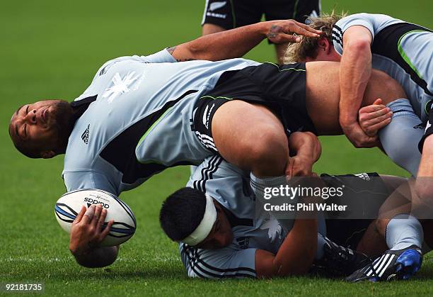 Neemia Tialata of the All Blacks is tackled during a New Zealand All Blacks training session at the Waitakere Trusts Stadium on October 22, 2009 in...
