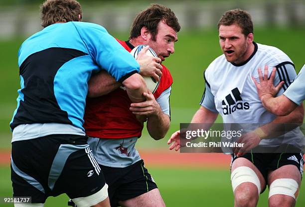 Andrew Hore of the All Blacks hits the tackle bags during a New Zealand All Blacks training session at the Waitakere Trusts Stadium on October 22,...