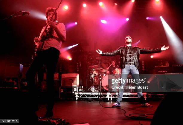 Sergio Pizzorno, Ian Matthews and Tom Meighan of Kasabian perform on stage as part of the Q Awards Gigs at The Forum on October 21, 2009 in London,...