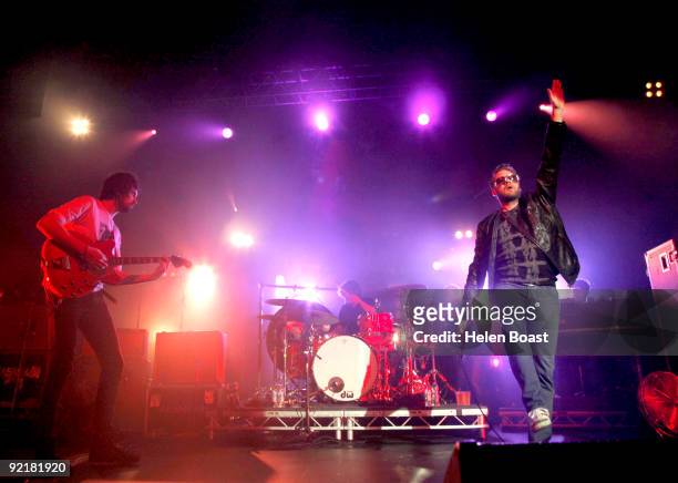 Sergio Pizzorno, Ian Matthews and Tom Meighan of Kasabian perform on stage as part of the Q Awards Gigs at The Forum on October 21, 2009 in London,...