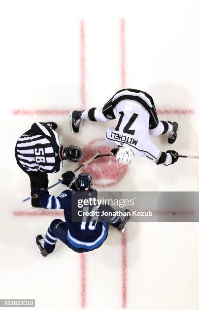 Bryan Little of the Winnipeg Jets takes a second period face-off against Torrey Mitchell of the Los Angeles Kings at the Bell MTS Place on February...