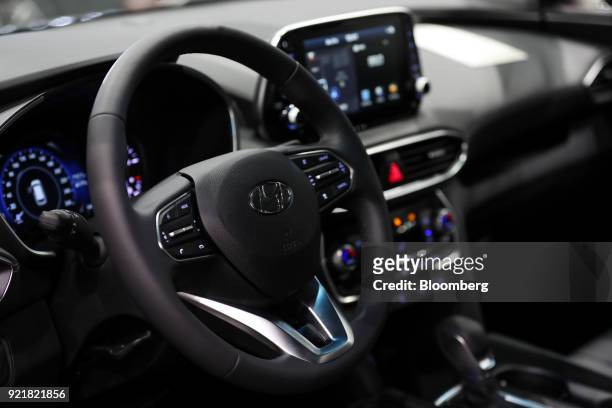 The interior of a Hyundai Motor Co. Santa Fe sport utility vehicle is seen during a launch event for the updated vehicle in Goyang, South Korea, on...