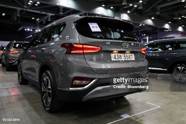 Hyundai Motor Co. Santa Fe sport utility vehicle stands on display during a launch event for the updated vehicle in Goyang, South Korea, on...