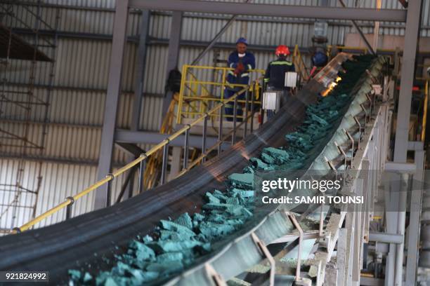 Conveyor belt carries chunks of Raw cobalt after a first transformation at a plant in Lubumbashi on February 16 before being exported, mainly to...