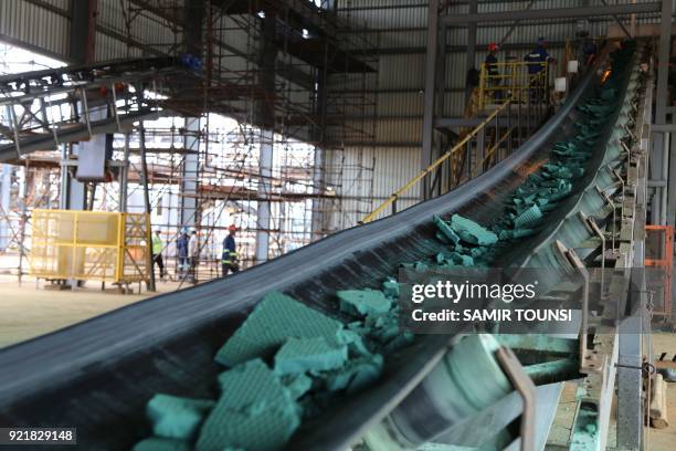 Conveyor belt carries chunks of Raw cobalt after a first transformation at a plant in Lubumbashi on February 16 before being exported, mainly to...