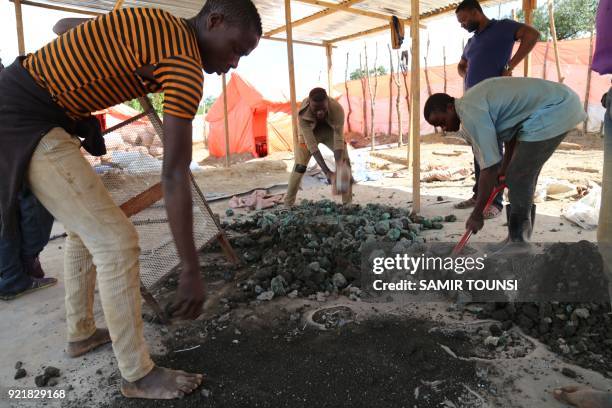 Artisanal miners are sort minerals on the road between Kolwezi and Lubumbashi, on February 15, 2018. To Promulgate or not to promulgate? Congolese...