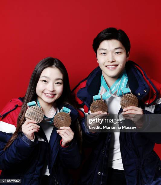 United States Figure skaters and siblings Maia Shibutani and older brother Alex Shibutani pose for a portrait with their bronze medals, one for the...