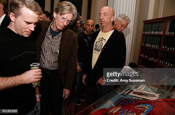 Musician Phil Lesh looks at exhibit samples at a fundraising reception in support of the new exhibition "The Grateful Dead: Now Playing" at the...