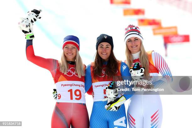 Gold medallist Sofia Goggia of Italy celebrates with silver medallist Ragnhild Mowinckel of Norway and bronze medallist Lindsey Vonn of the United...