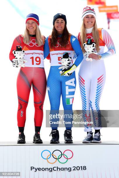 Gold medallist Sofia Goggia of Italy celebrates with silver medallist Ragnhild Mowinckel of Norway and bronze medallist Lindsey Vonn of the United...