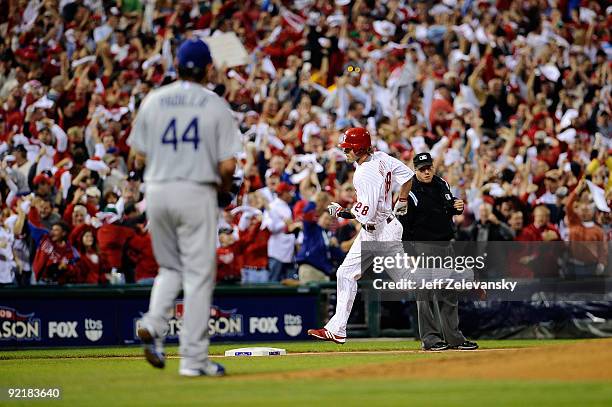 Jayson Werth of the Philadelphia Phillies rounds the bases after hitting a first inning home run off of Vicente Padilla of the Los Angeles Dodgers in...