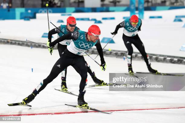 Johannes Rydzek of Germany leads to Fabian Riessle of Germany and Eric Frenzel of Germany to win the gold medal in the Nordic Combined Individual...