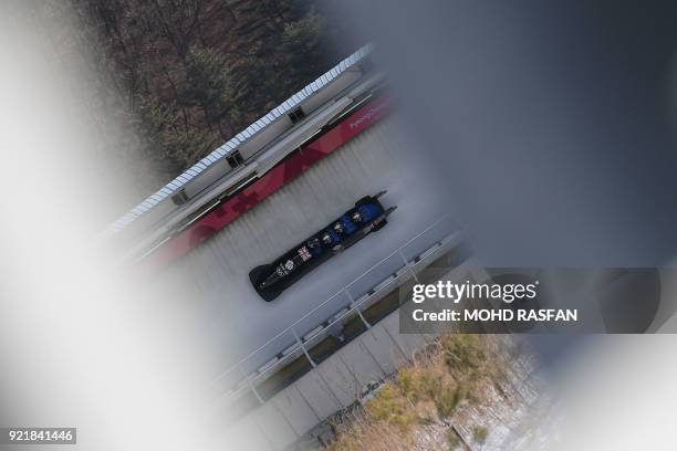 Lamin Deen, Andrew Matthews, Toby Olubi and Ben Simons of Great Britain take part in a training session for the men's 4-man bobsleigh during the...