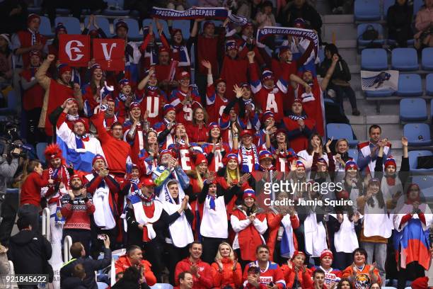 Fans cheer as Evgenia Medvedeva of Olympic Athlete from Russia competes during the Ladies Single Skating Short Program on day twelve of the...