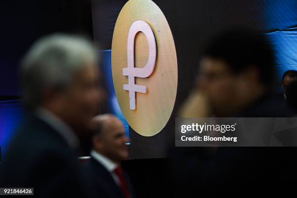 Logo of the new Venezuelan cryptocurrency Petro is seen during the launch event in Caracas, Venezuela, on Tuesday, Feb. 20, 2018. Maduro launched...