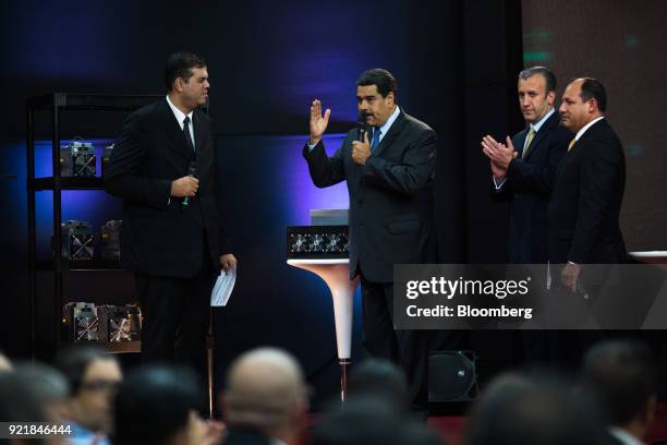 Nicolas Maduro, Venezuela's president, center, speaks as Tareck El Aissami, Venezuela's vice president, second from right, Hugbel Roa, minister for...