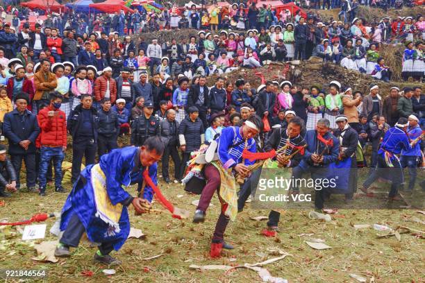 Miao people play Lusheng during the worshipping ceremony of ancestors on the fifth day of the Lunar New Year on February 20, 2018 in Guiyang, Guizhou...