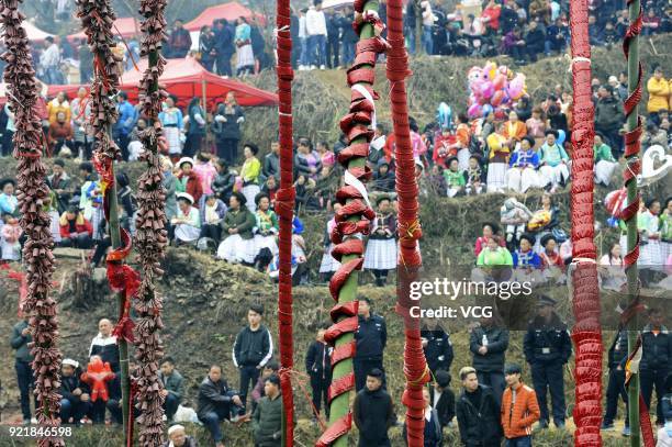 Miao people set off firecrackers during the worshipping ceremony of ancestors on the fifth day of the Lunar New Year on February 20, 2018 in Guiyang,...