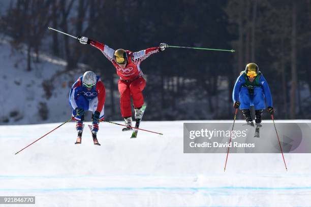 Sergey Ridzik of Olympic athletes of Russia, Francois Place of France, and Siegmar Klotz of Italy competes in the Freestyle Skiing Men's Ski Cross...