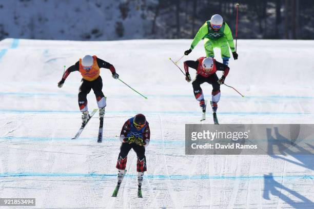 Filip Flisar of Slovenia, Marc Bischofberger of Switzerland and Brady Leman of Canada and Armin Niederer of Switzerland compete in the Freestyle...