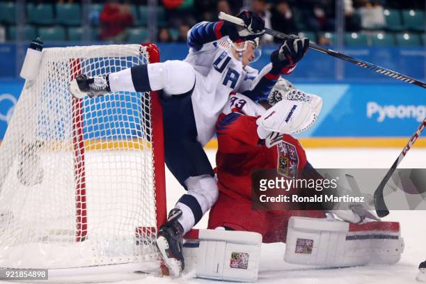 Ryan Donato of the United States attempts a shot on Pavel Francouz of the Czech Republic as they collide in overtime during the Men's Play-offs...