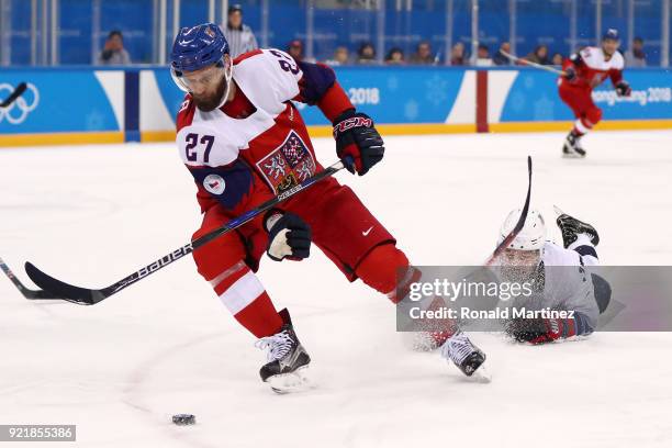 Martin Ruzicka of Czech Republic contols the puck against Chris Bourque of the United States during the Men's Play-offs Quarterfinals on day twelve...