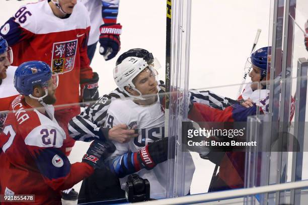 Jim Slater of the United States collides with Roman Cervenka of the Czech Republic in the second period during the Men's Play-offs Quarterfinals on...