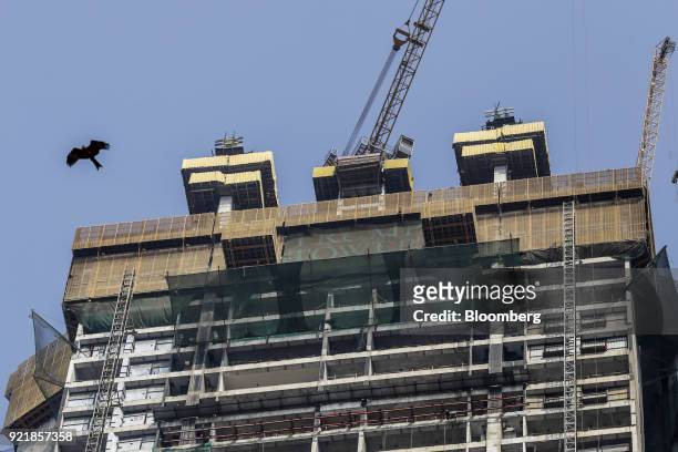 Signage is displayed atop one of two towers of Trump Tower Mumbai under construction at Lodha The Park, a luxury residential project developed by...