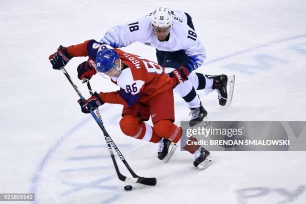 Czech Republic's Tomas Mertl and USA's Jordan Greenway fight for the puck during the men's quarterfinals playoffs ice hockey match between Czech...