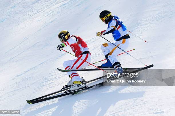 Christoph Wahrestoetter of Austria, Erik Mobaerg of Sweden compete in the Freestyle Skiing Men's Ski Cross 1/8 finals on day 12 of the PyeongChang...
