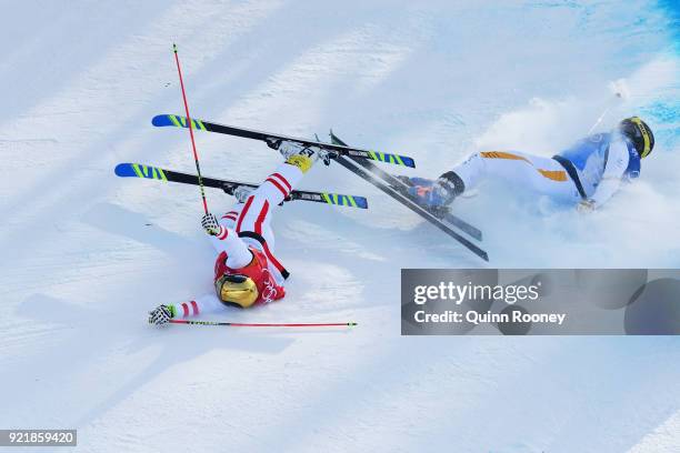 Christoph Wahrestoetter of Austria, Erik Mobaerg of Sweden crash in the Freestyle Skiing Men's Ski Cross 1/8 finals on day 12 of the PyeongChang 2018...