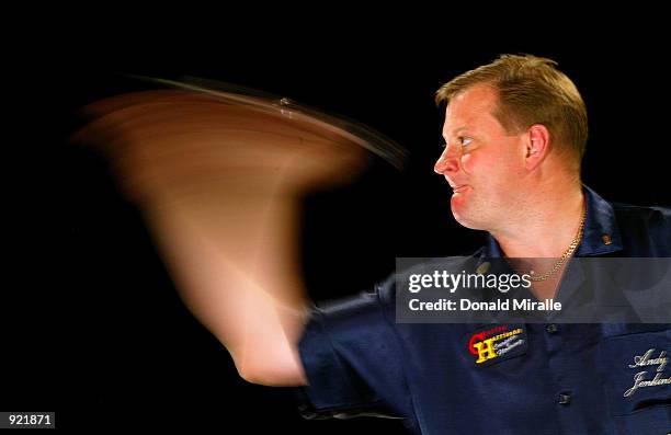 Andy Jenkins of Great Britain shows his hand speed as he throws darts during the Desert Classic Darts Championships at the MGM Grand Hotel and Casino...