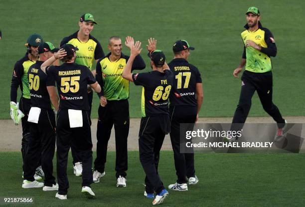 Australia's Ashton Agar celebrates with teammates after dismissing New Zealand's Kane Williamson during the final Twenty20 Tri Series international...