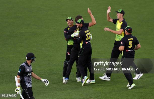 Australia celebrate taking the wicket of New Zealand's Mitchell Santner during the final Twenty20 Tri Series international cricket match between New...