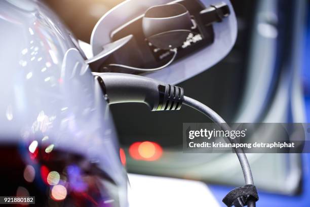 electric car charging. - electric engine stock pictures, royalty-free photos & images