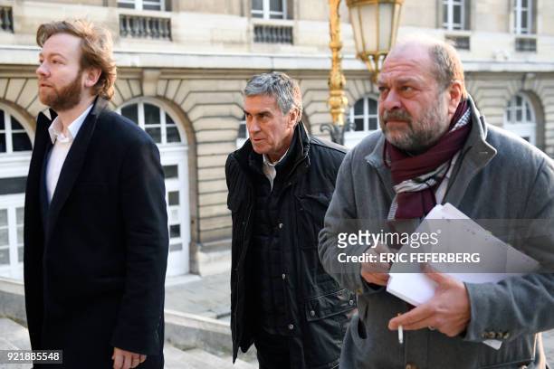 French former budget minister Jerome Cahuzac and his lawyers Eric Dupond-Moretti and Antoine Vey arrive at Paris' courthouse on February 21, 2018 for...