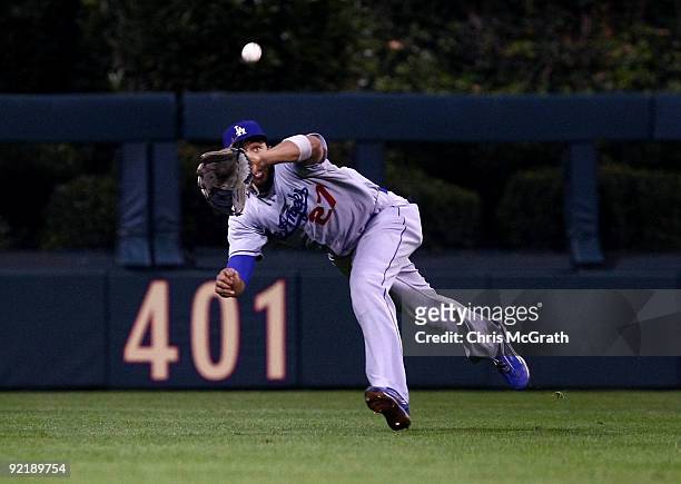 Matt Kemp of the Los Angeles Dodgers makes a diving catch against the Philadelphia Phillies in Game Five of the NLCS during the 2009 MLB Playoffs at...